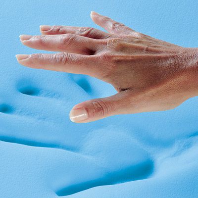 Hand pushing on foam