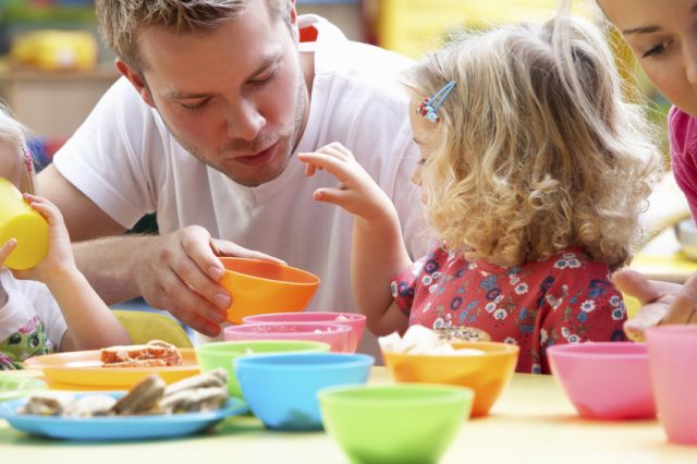 A father interacting with his daughter as being social leads to happiness and living longer.