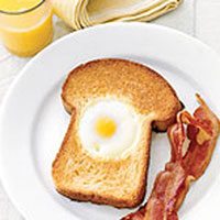 Countryliving.com Egg in the Hole, a great breakfast in bed idea for your mom on Mother's Day.