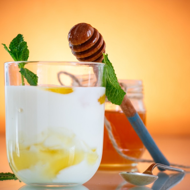 Greek yogurt with honey in a glass