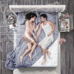 Woman and man laying in nightwear on an elegant bed.