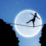 Woman walking along a tight rope with the moon in the background.